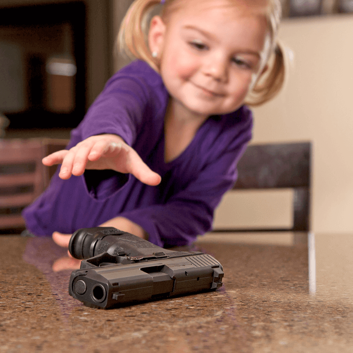a picture of a child reaching for a firearm