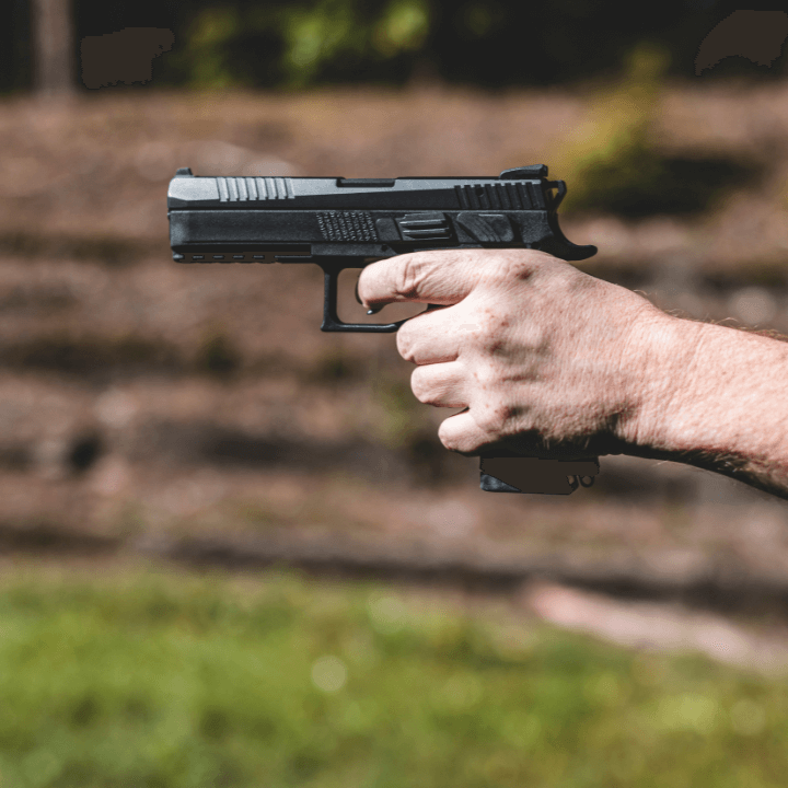 A picture of someone holding a handgun.